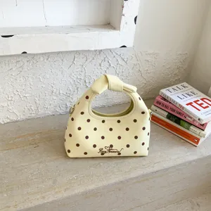 Borsa a mano gialla a pois chic con manico annodato, borsa a tracolla elegante donna.