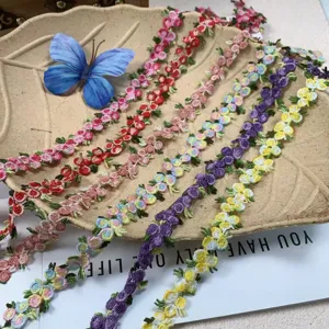 Close-up of colorful 3D floral embroidery lace trim, perfect for DIY crafts and apparel.