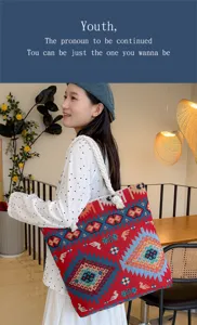 Detail view of the ethnic pattern canvas tote bag with thick rope handle in use.