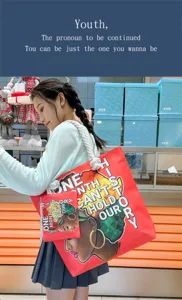 Sac cabas en toile léger avec imprimé graphique, sac d'épaule élégant pour le shopping des femmes.