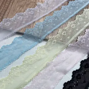 Detail shot of 5cm wide heart embroidered lace trim in multiple colors, perfect for DIY crafts.