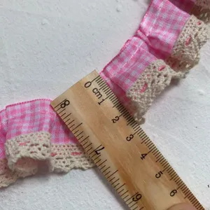 Pink gingham pleated lace trim detail view showing 3cm width with wooden ruler for diy parts.