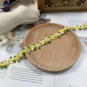 Detailed shot of 2cm colorful floral embroidered lace trim, close-up texture for DIY craft.