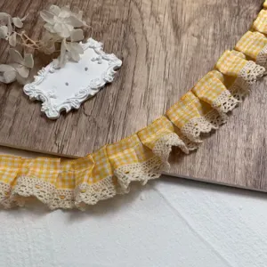 Details of yellow plaid pleated lace ribbon trim for DIY sewing, crafts and doll clothes.