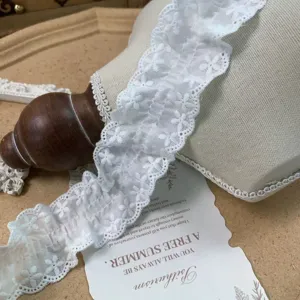 White ruffled cotton lace trim detail shot, 4.5cm wide delicate fabric edging for crafts.