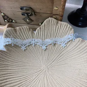 White water-soluble embroidered lace trim detail, delicate floral pattern for DIY craft dress decor