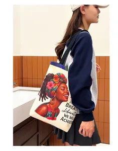 Canvas tote bag detail showing large capacity, artistic portrait print and stylish shoulder strap.