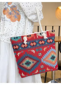 Large capacity canvas tote bag with ethnic geometric totem embroidery and rope handles.