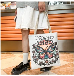 Bolso de hombro casual de lona con estampado de mariposa vintage 1980, ideal para uso diario.