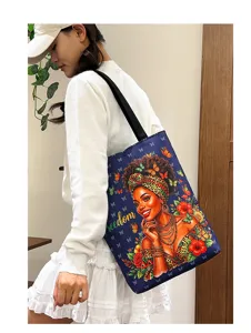 Canvas shoulder bag detail showing the artistic black woman print and spacious design.