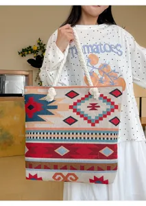 Detailed view of the ethnic style woven canvas tote bag with thick rope handles and pattern.