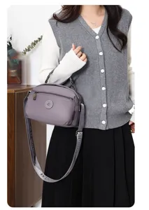 Casual grey oxford cloth shoulder bag for women, lightweight and durable crossbody design.