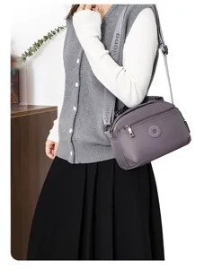 Casual nylon crossbody shoulder bag for women, simple solid color travel daily purse.