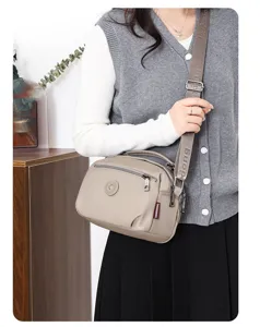 Casual nylon crossbody shoulder bag for women, simple solid color daily casual handbag.