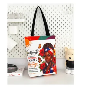 Grand sac cabas en toile avec imprime de femme noire, sac a epaule pour usage quotidien.