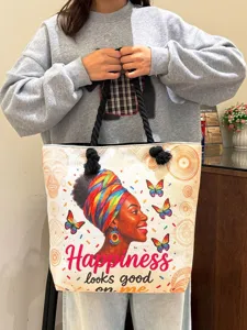 Stijlvolle canvas shopper met kleurrijke Afrikaanse vrouwenprint en dikke touw handvatten.