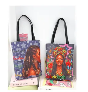 Vue détaillée du grand cabas en toile avec imprimé élégant de femme noire et thème.