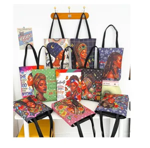 Grand sac cabas en toile avec impression artistique noire élégante, sac bandoulière durable.