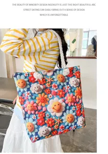 Detail shot of canvas tote bag with 3D smiley flower pattern, casual shoulder bag for women.