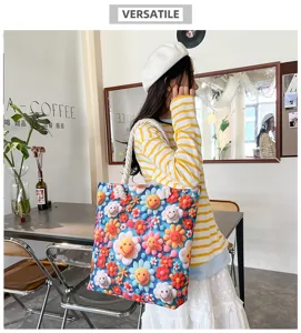 Stylish canvas tote bag with vibrant flower and smiley face print and thick rope handles.