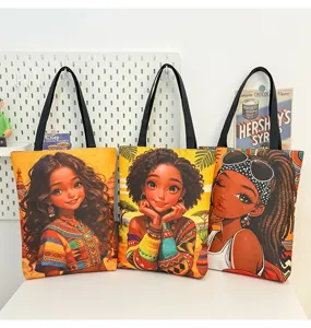 Vue détaillée du sac cabas en toile tendance avec un imprimé graphique de fille ethnique.