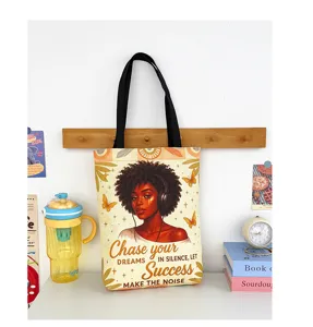 Canvas tote bag with motivational quote print, large capacity shoulder bag detail view.