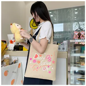 Borsa a tracolla in tela beige con elefante carino e stampa di testo stimolante per uso quotidiano.