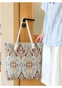 Large capacity ethnic tote bag with woven totem pattern and thick rope handles for daily use.