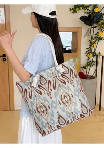 Large capacity ethnic style embroidered canvas tote bag with thick rope handles for women.