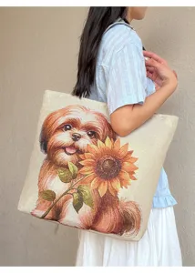 Detailansicht einer grossen Segeltuch-Tragetasche mit einem niedlichen Hund- und Sonnenblumen-Muster.