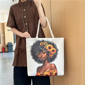 Detail view of large canvas tote bag with sunflower black woman graphic, hemp rope handle style.