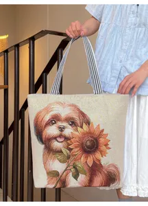 Detailed view of large canvas tote bag with cute dog and sunflower woven pattern and striped handles.