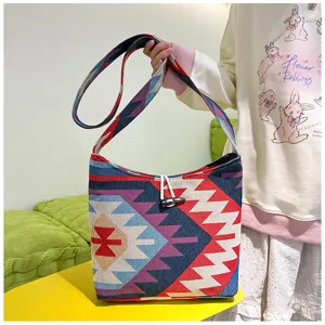 Ethnic style canvas shoulder bag detail, featuring colorful geometric woven patterns and wooden toggle.