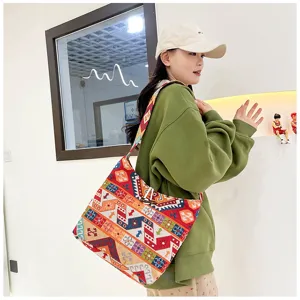 Ethnic style embroidered shoulder bag, canvas cross body bag with colorful geometric patterns.