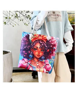 Detailansicht einer stylischen Segeltuchtasche mit farbenfrohem schwarzem Mädchen-Kunstdruck, Griffe.