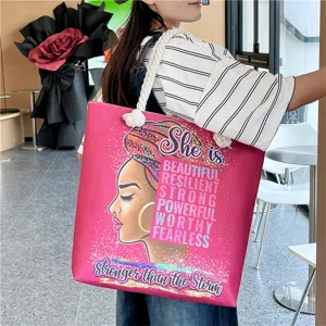 Large capacity canvas shoulder tote bag with hemp rope handles and inspirational graphic print.