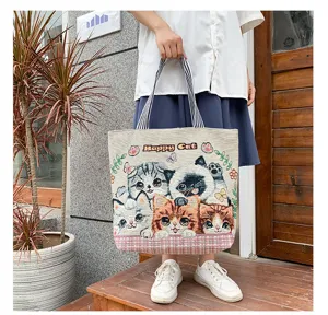 Cute cartoon cat canvas tote bag casual shoulder handbag for daily shopping and travel use.