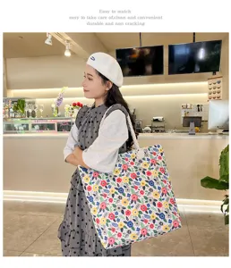 Fashionable floral canvas shoulder bag with rope handles, casual beach tote for women.