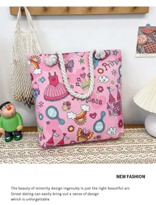 Pink canvas beach tote bag with cute cartoon princess print and thick rope handles.