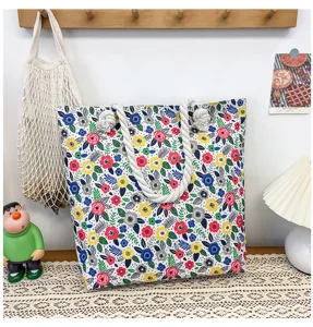 Casual floral canvas tote bag with thick rope handles, perfect for beach and daily shopping.