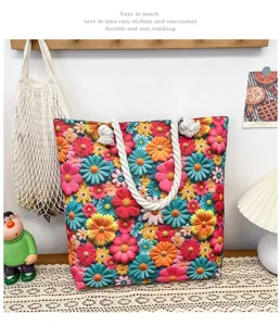 Detailed view of colorful floral canvas beach bag with thick rope handles in cozy room setup.