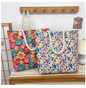 Detailed view of stylish canvas beach tote bag with vibrant floral print and thick hemp rope handles.
