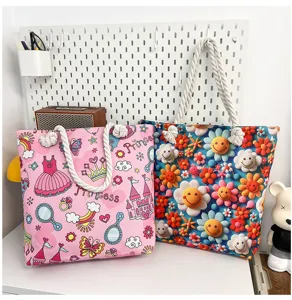 Canvas tote bag detail, featuring cute floral and princess cartoon prints with rope handles.