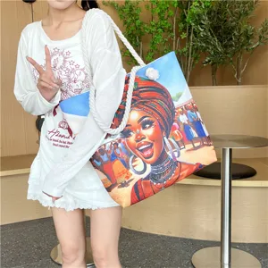 Large capacity canvas tote bag with ethnic West African art print and thick rope handles.