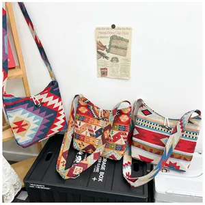 Detailed view of the ethnic style canvas crossbody bag showcasing colorful geometric patterns.
