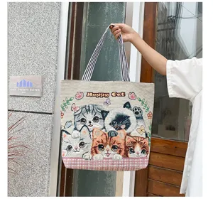 Cute cat canvas shoulder bag for women, stylish large capacity tote daily shopping bag.