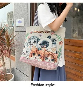 Woven canvas tote bag featuring cute cat patterns and shoulder strap design for daily use.