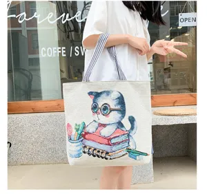 Cute cat print canvas shoulder bag, casual large capacity shopping tote for women daily use.
