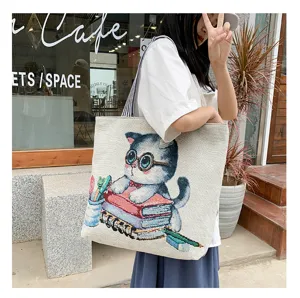 Stylish canvas tote bag featuring cute cat and book woven pattern, casual large capacity.