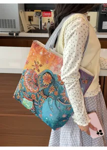 Sac à bandoulière en toile style ethnique avec motif éléphant coloré et lanières.
